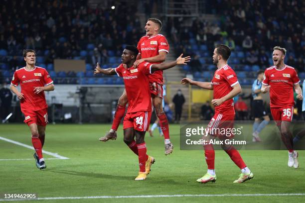 Taiwo Awoniyi of 1.FC Union Berlin celebrates with teammate Grischa Proemel after scoring their side's second goal during the DFB Cup second round...