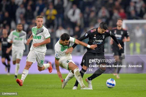 Alvaro Morata of Juventus fights for the ball with Kann Ayhan of US Sassuolo during the Serie A match between Juventus and US Sassuolo at Allianz...