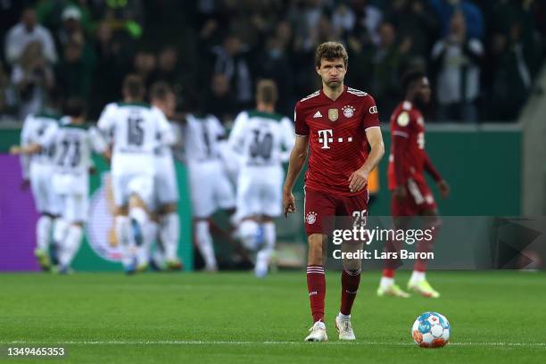 Thomas Mueller of FC Bayern Muenchen reacts after Ramy Bensebaini of Borussia Moenchengladbach scored their teams third goal during the DFB Cup...