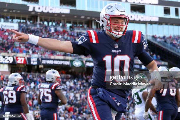 Mac Jones of the New England Patriots celebrates during the game against the New York Jets at Gillette Stadium on October 24, 2021 in Foxborough,...