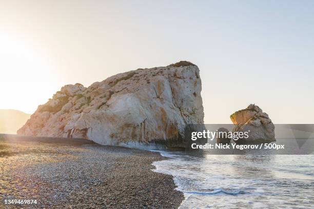 scenic view of rocks in sea against clear sky,kouklia,cyprus - limassol stock-fotos und bilder