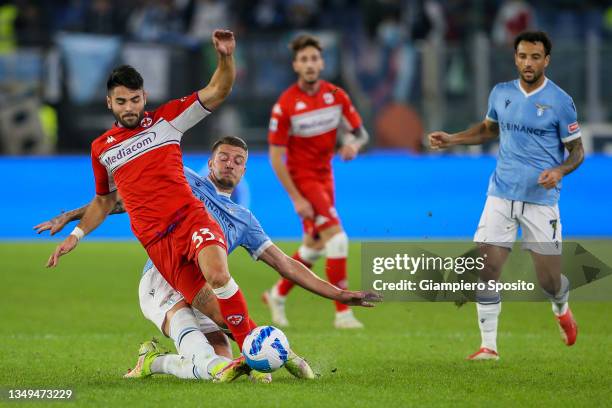 Riccardo Sottil of ACF Fiorentina is tackled by Serjei Milinkovic Savic of SS Lazio during the Serie A match between SS Lazio and ACF Fiorentina at...