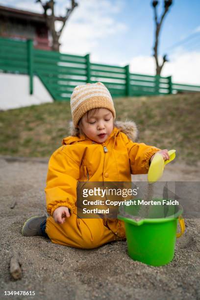 a child playing in a sandbox - 2 girls 1 sandbox stock pictures, royalty-free photos & images