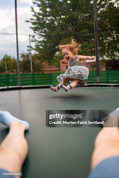 a baby playing on a trampoline - oslo play fotografías e imágenes de stock