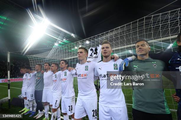 Borussia Moenchengladbach players acknowledge the fans following victory in the DFB Cup second round match between Borussia Mönchengladbach and...