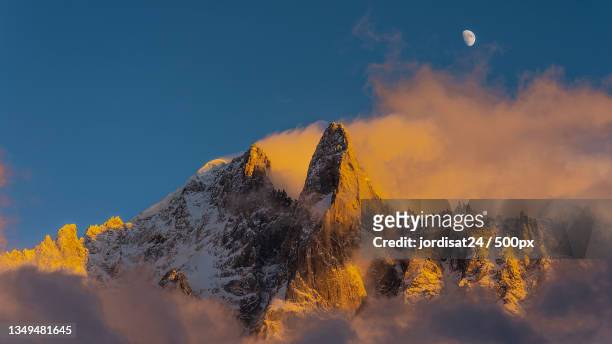 low angle view of snowcapped mountains against sky during sunset,chamonix,france - chamonix stock pictures, royalty-free photos & images