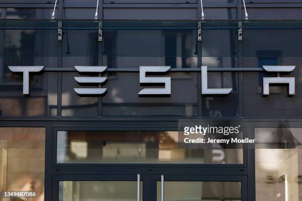 View of the Tesla logo photographed on October 24, 2021 in Cologne, Germany.