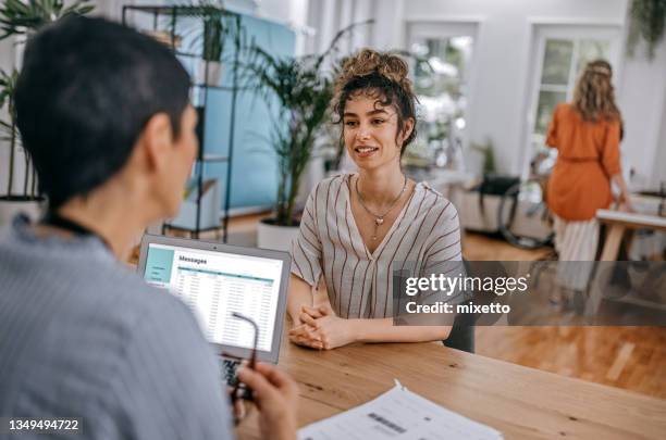 two businesswomen discussing at office - job interview stock pictures, royalty-free photos & images