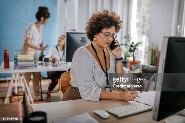 businesswoman working at office - fat asian woman stock pictures, royalty-free photos & images
