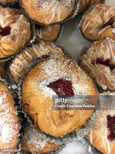 traditional gourmet french pastries, delicate danish pastries in france, freshly baked organic cherry cakes dusted with sugar in bakery in paris, organic patisserie in trendy bistro - danish culture stock pictures, royalty-free photos & images