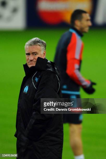 Head coach Didier Deschamps of Marseille walks on the pitch during a training session ahead of their UEFA Champions League group F match against...