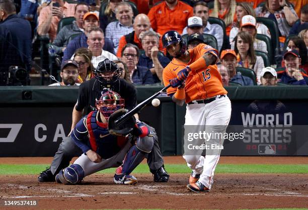 Martin Maldonado of the Houston Astros hits an RBI single against the Atlanta Braves during the second inning in Game Two of the World Series at...