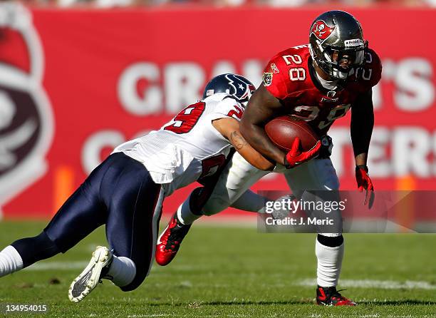 Running back Kregg Lumpkin of the Tampa Bay Buccaneers runs the ball against the Houston Texans during the game at Raymond James Stadium on November...