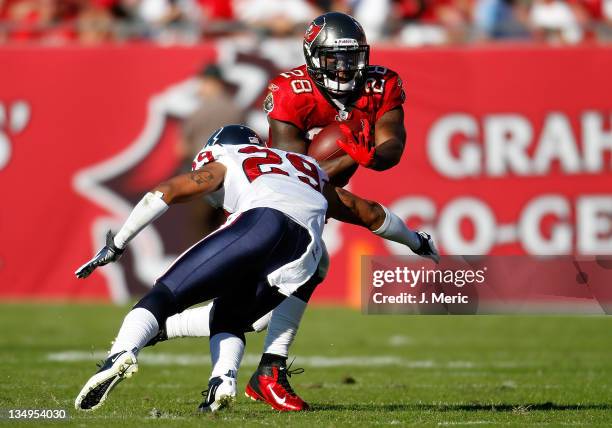 Running back Kregg Lumpkin of the Tampa Bay Buccaneers runs the ball against the Houston Texans during the game at Raymond James Stadium on November...