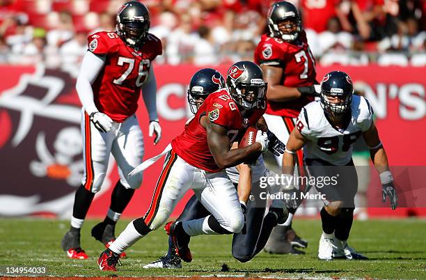 Running back Kregg Lumpkin of the Tampa Bay Buccaneers runs the ball against the Houston Texans during the game at Raymond James Stadium on November...