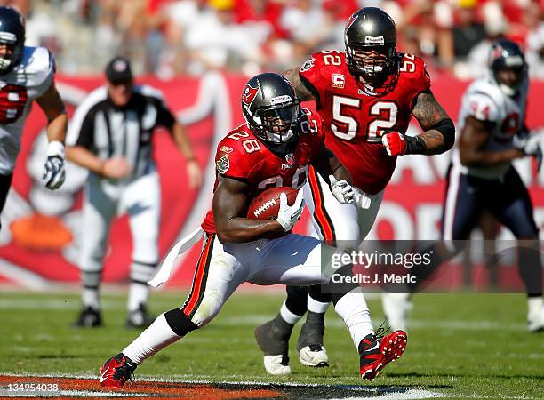 Running back Kregg Lumpkin of the Tampa Bay Buccaneers runs the ball against the Houston Texans during the game at Raymond James Stadium on November...