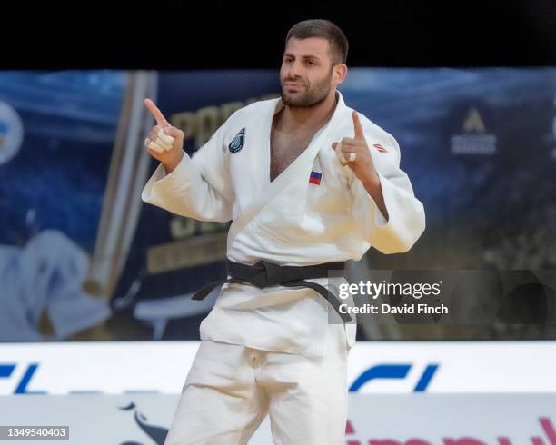 Arman Adamian of Russia celebrates winning the u100kg gold medal after throwing 2013 World champion and 2012 Olympic silver medallist, Asley Gonzalez...