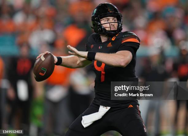 Tyler Van Dyke of the Miami Hurricanes looks to pass against the North Carolina State Wolfpack at Hard Rock Stadium on October 23, 2021 in Miami...