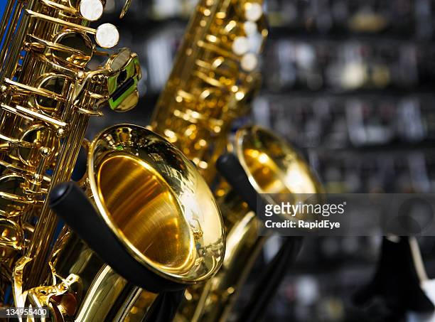 saxophones - music shop stock pictures, royalty-free photos & images
