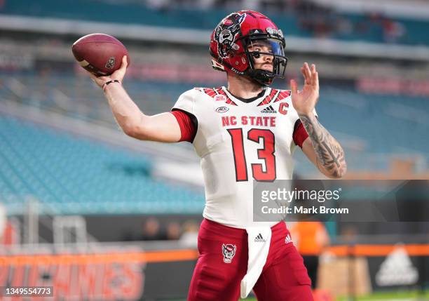 Devin Leary of the North Carolina State Wolfpack warms up prior to the game against the Miami Hurricanes at Hard Rock Stadium on October 23, 2021 in...