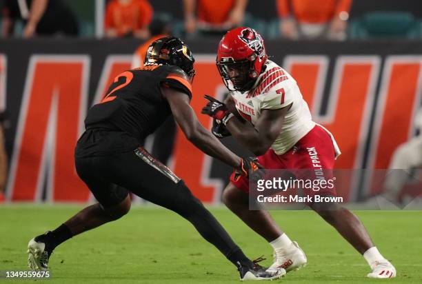 Zonovan Knight of the North Carolina State Wolfpack runs with the ball against the Miami Hurricanes at Hard Rock Stadium on October 23, 2021 in Miami...