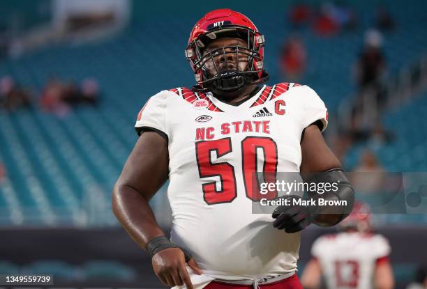 Grant Gibson of the North Carolina State Wolfpack warms up prior to the game against the Miami Hurricanes at Hard Rock Stadium on October 23, 2021 in...