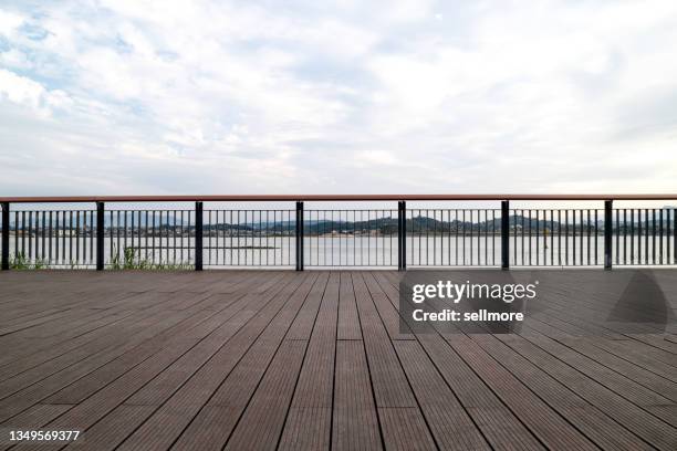 boardwalk by the water - wooden railing stock pictures, royalty-free photos & images