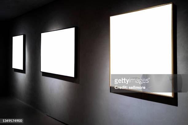 three picture frames on black concrete wall - exhibition space stock pictures, royalty-free photos & images