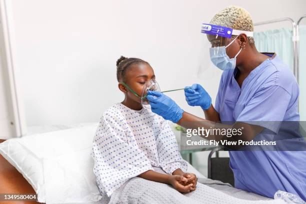 nurse hospitalized child sick with covid-19 use medical ventilator for breathing - child coronavirus sick stock pictures, royalty-free photos & images