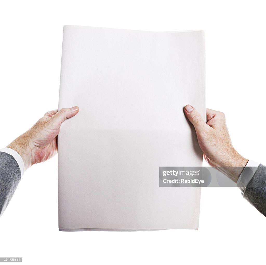 Hot off the press! Man's hands hold blank newspaper.