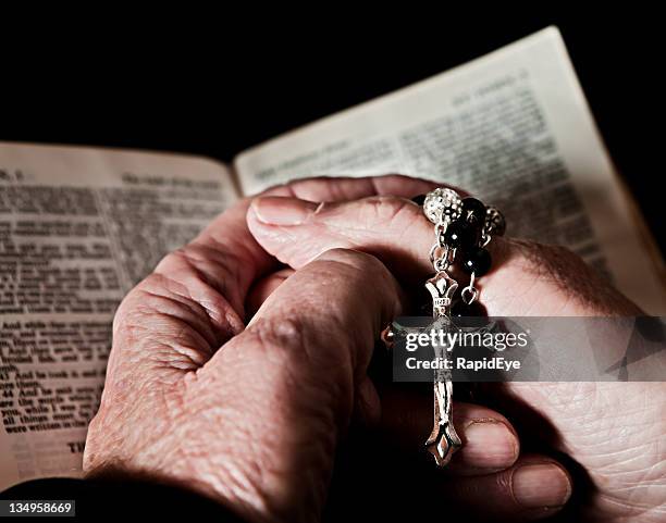 praying for salvation - rosary beads stock pictures, royalty-free photos & images