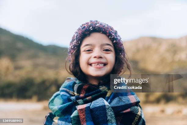 cute girl smiling - warme kleding stockfoto's en -beelden