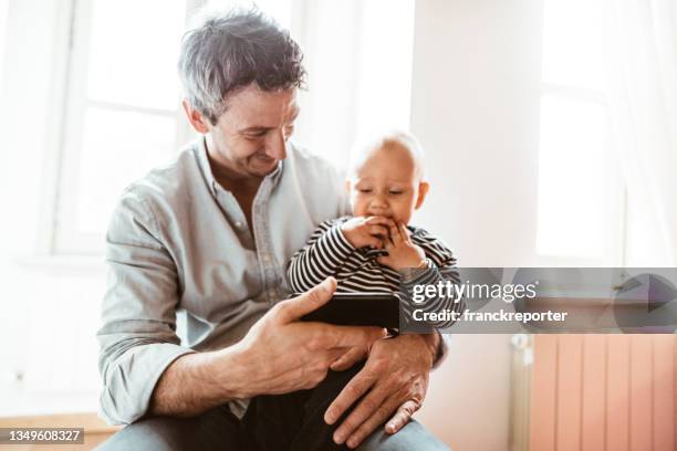 dad spending time with the son - z com stock pictures, royalty-free photos & images