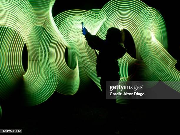 child looking for mobile coverage in a virtual environment. - digital native stock pictures, royalty-free photos & images