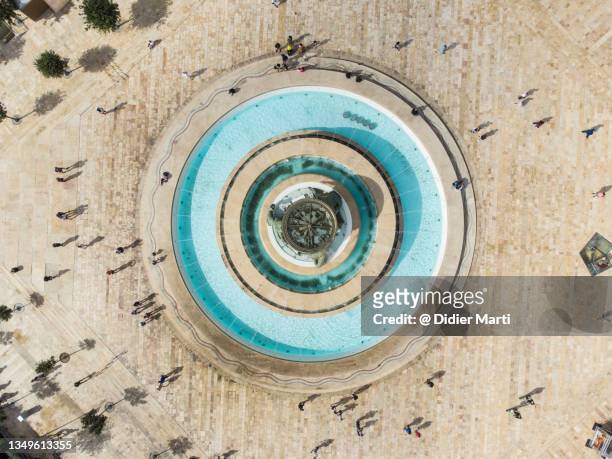top down view of the triton fountain at the entrance of valletta old town in malta - aerial courtyard stock pictures, royalty-free photos & images