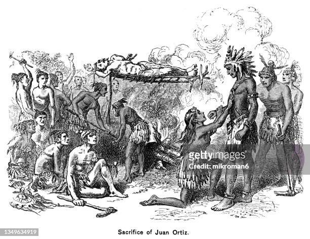 old engraved illustration of sacrifice of juan ortiz, spanish sailor who was held captive by native americans in florida for eleven years, from 1528 until he was rescued by the hernando de soto expedition in 1539 - native americans 1800s stockfoto's en -beelden