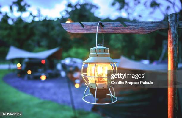 lantern light outdoor camping in the evening - camping lantern stock pictures, royalty-free photos & images