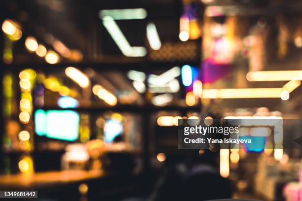 abstract defocused background of restaurant or casino neon lights indoors - street restaurant stockfoto's en -beelden