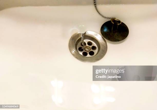 swirling water - sink plug stock pictures, royalty-free photos & images