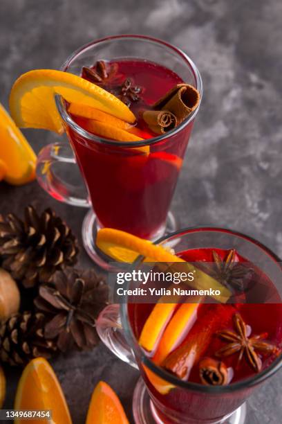 two mugs of mulled wine. hot winter drinks. - punsch stock-fotos und bilder