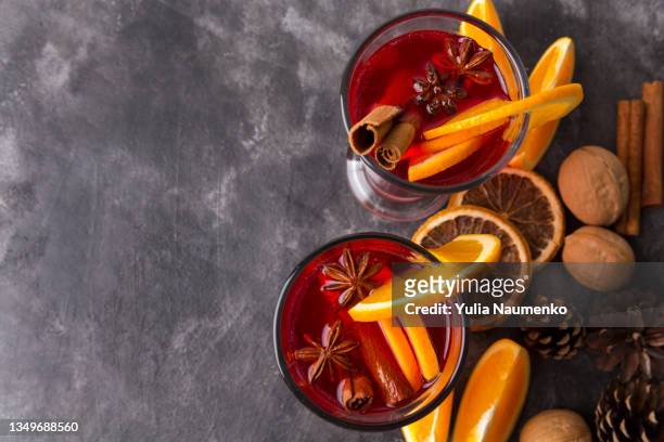 two mugs of mulled wine. hot winter drinks. - cocktail recipe stock pictures, royalty-free photos & images
