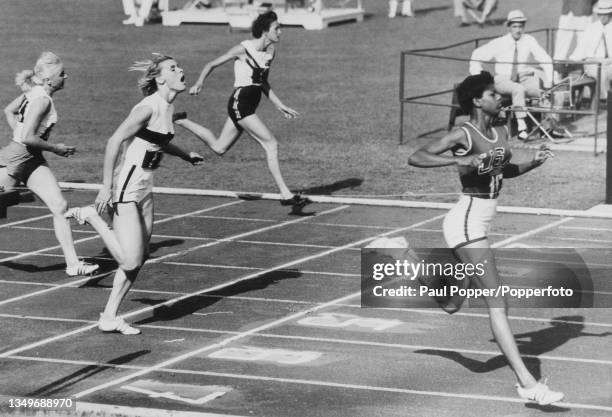 Polish athlete Barbara Janiszewska , German athlete Jutta Heine, British athlete Jenny Smart, and American athlete Wilma Rudolph as Rudolph wins the...