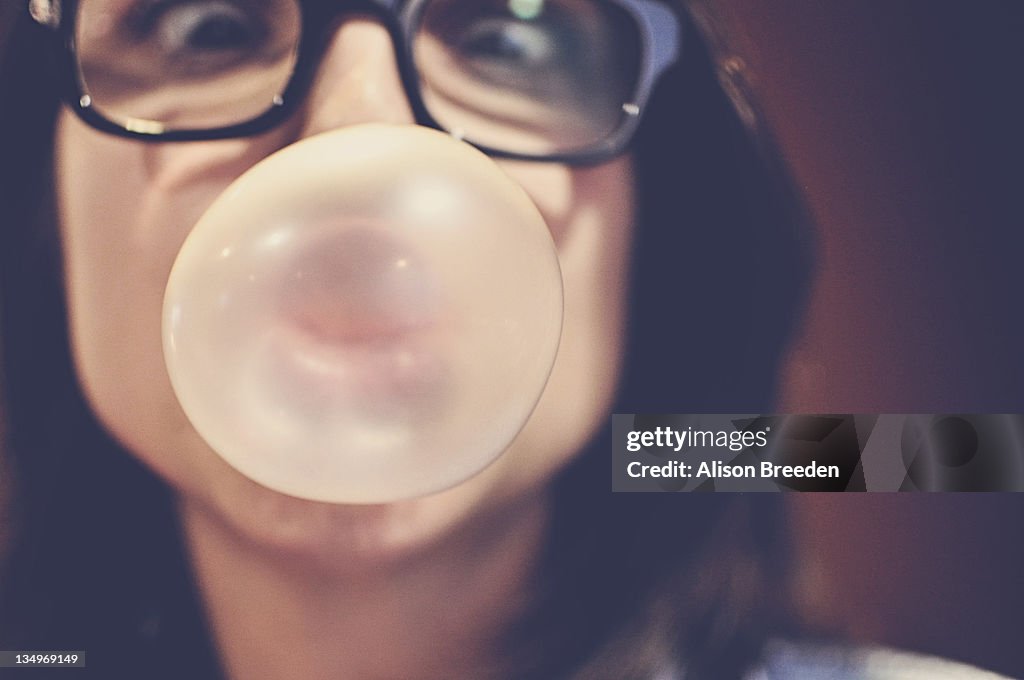 Girl blowing bubble