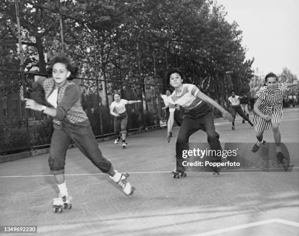 Female competitors in the girls' division of the 75-yard race during the Winged Skates contest, held at the Eleanor Roosevelt Playground in New York...