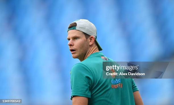 Steve Smith of Australia warms up ahead of the ICC Men's T20 World Cup match between Australia and Sri Lanka at Dubai International Stadium on...