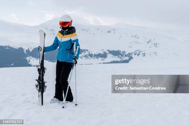 a young girl skiing in the mountains in voineasa, in transcarpathia, romania. - woman on ski lift stock pictures, royalty-free photos & images