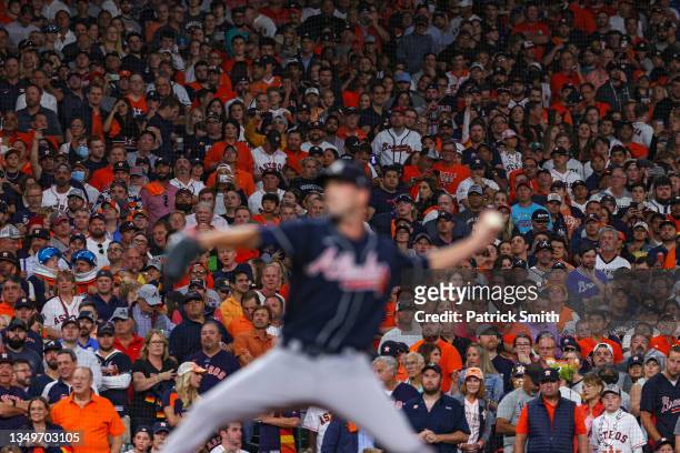 Fans look on as Drew Smyly of the Atlanta Braves pitches against the Houston Astros during the seventh inning in Game Two of the World Series at...