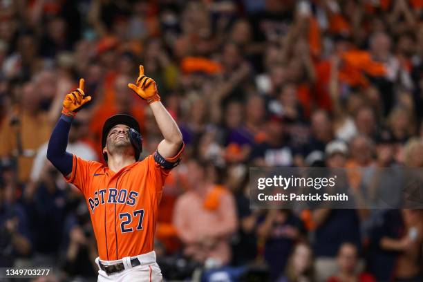 Jose Altuve of the Houston Astros celebrates after hitting a solo home run against the Atlanta Braves during the seventh inning in Game Two of the...