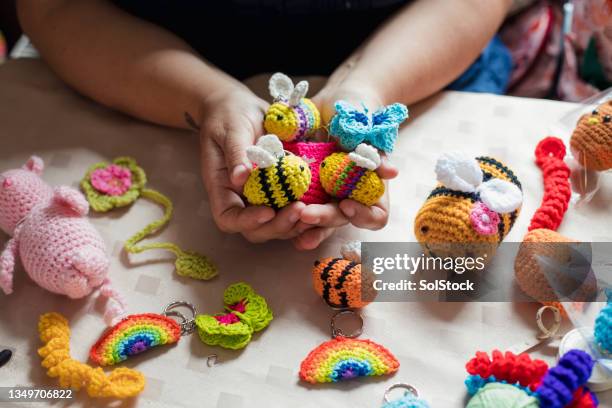 crocheting at the store - stuffed toy stock pictures, royalty-free photos & images