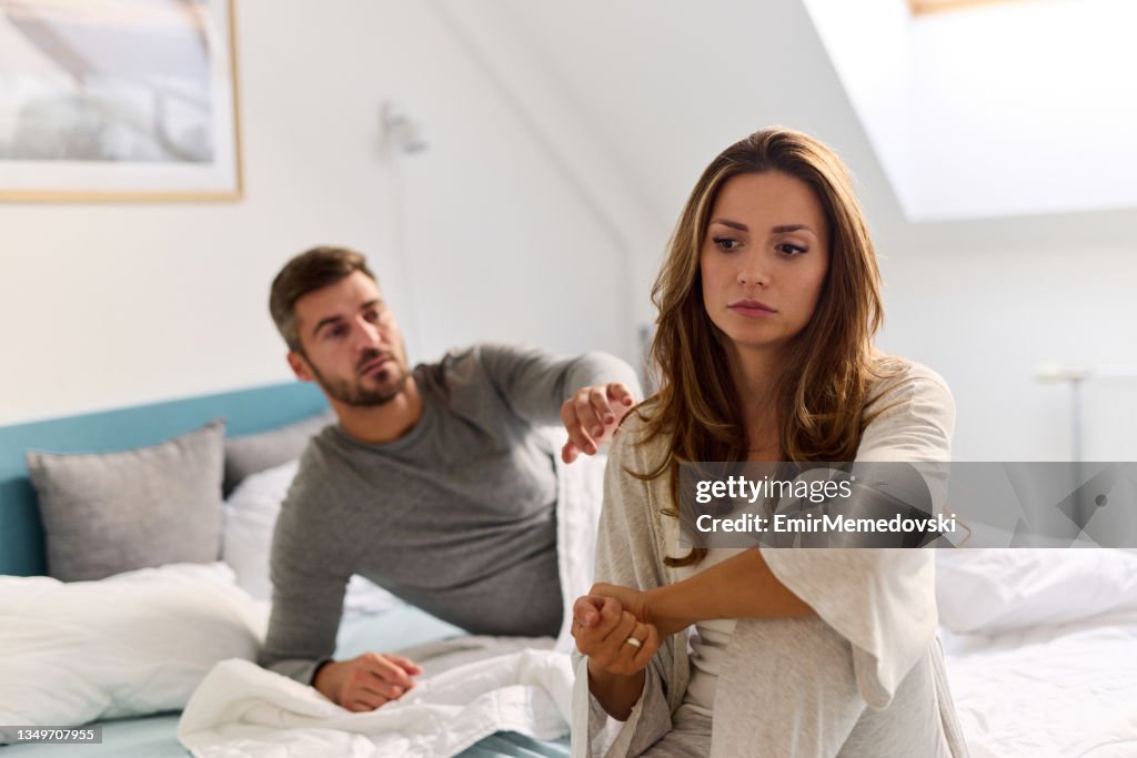 Unhappy couple having crisis and difficulties in relationship